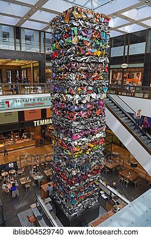 Stock Image - Atrium in the luxury shopping arcade The Q, with artwork The Tower of Klythie, artist John Chamberlain, Friedrichstraße, Berlin, Germany, Europe. Fotosearch