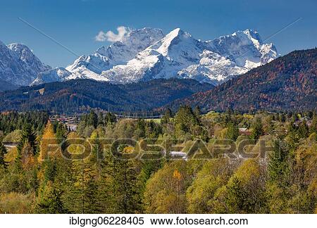 Stock Photography - Autumn landscape in the Isar valley with Alpspitze and Zugspitze in the Wetterstein range, Wallgau, Isar, Werdenfelser Land, Alpenwelt Karwendel, Upper Bavaria, Bavaria, Germany, Europe. Fotosearch