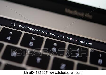 Backlit keyboard and Touch Bar showing search bar, laptop, Apple MacBook Pro, close-up View Large Photo Image Stock Photo - Backlit keyboard and Touch Bar showing search bar, laptop, Apple MacBook Pro, close-up. Fotosearch