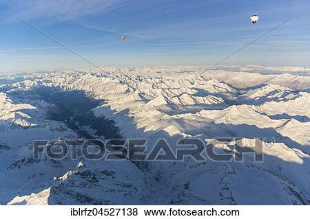 Balloon ride over snowy Alps, 5600m altitude, at front Arntal, Zillertal and Tuxertal, Austria, Europe View Large Photo Image Stock Photo - Balloon ride over snowy Alps, 5600m altitude, at front Arntal, Zillertal and Tuxertal, Austria, Europe. Fotosearch