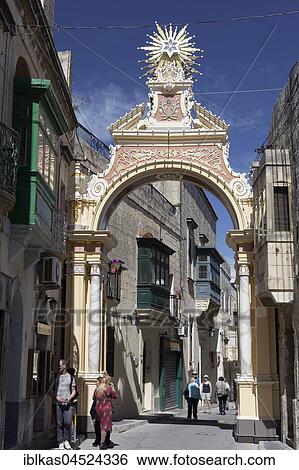 Stock Photograph - Baroque arcade in an old town alleyway, decoration for patronal festival, Festa San Guzepp, Rabat, Malta, Europe. Fotosearch