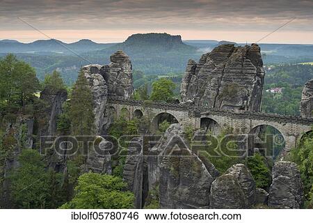 Bastion with Wehlnadel and Wehlgrund to the Lilienstein at sunrise, Saxony, Germany, Elbe Sandstone Mountains, National Park Saxon Switzerland, Europe View Large Photo Image Stock Photograph - Bastion with Wehlnadel and Wehlgrund to the Lilienstein at sunrise, Saxony, Germany, Elbe Sandstone Mountains, National Park Saxon Switzerland, Europe. Fotosearch
