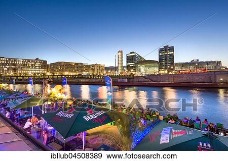 Beach bar Capital Beach at dusk at the river Spree opposite central railway station, Berlin-Mitte, Berlin, Germany, Europe View Large Photo Image Stock Photo - Beach bar Capital Beach at dusk at the river Spree opposite central railway station, Berlin-Mitte, Berlin, Germany, Europe. Fotosearch
