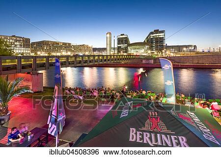 Beach bar Capital Beach at dusk at the river Spree opposite central railway station, Berlin-Mitte, Berlin, Germany, Europe View Large Photo Image Stock Photograph - Beach bar Capital Beach at dusk at the river Spree opposite central railway station, Berlin-Mitte, Berlin, Germany, Europe. Fotosearch