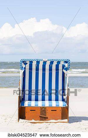 Beach chair on the beach, Amrum, North Frisian Islands, Schleswig-Holstein, Germany, Europe View Large Photo Image Stock Photo - Beach chair on the beach, Amrum, North Frisian Islands, Schleswig-Holstein, Germany, Europe. Fotosearch