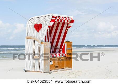 Beach chair with red heart on the beach, Amrum, North Frisian Islands, Schleswig-Holstein, Germany, Europe View Large Photo Image Picture - Beach chair with red heart on the beach, Amrum, North Frisian Islands, Schleswig-Holstein, Germany, Europe. Fotosearch