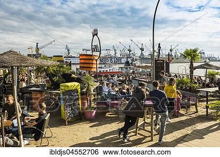 Beach Club Strand Pauli, at the jetties in the Port of Hamburg, Hamburg, Germany, Europe View Large Photo Image Stock Photograph - Beach Club Strand Pauli, at the jetties in the Port of Hamburg, Hamburg, Germany, Europe. Fotosearch