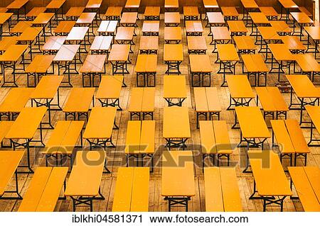 Stock Image - Beer tables in marquee, Oktoberfest, Theresienwiese, Munich, Upper Bavaria, Bavaria, Germany, Europe. Fotosearch