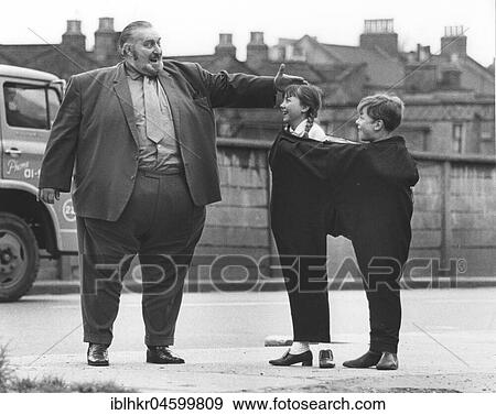 Big man with children, England, Great Britain View Large Photo Image Stock Photo - Big man with children, England, Great Britain. Fotosearch