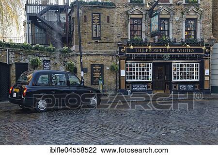 Black Taxi, Black Cap, in front of Restaurant, Pub, The Prospect of Whitby, Shadwell, London, England, United Kingdom, Europe View Large Photo Image Stock Image - Black Taxi, Black Cap, in front of Restaurant, Pub, The Prospect of Whitby, Shadwell, London, England, United Kingdom, Europe. Fotosearch
