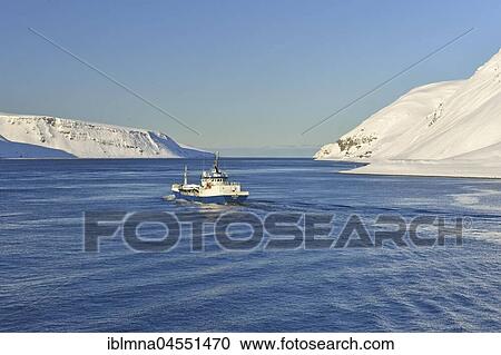 Stock Image - Blue-and-white ship, Meerenge, Magerøysund, Finnmark, Norway, Europe. Fotosearch