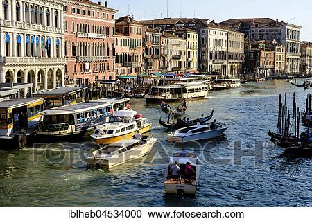 Stock Image - Boat trip on the Canal Grande at the stop Rialto, Venice, Veneto, Italy, Europe. Fotosearch