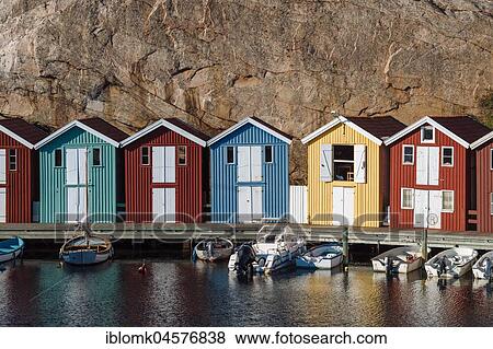 Stock Photo - Boats and colourful boathouses in the harbour of Smögen, Smögenbryggan, Västra Götalands Län, Bohuslän, Sweden, Europe. Fotosearch