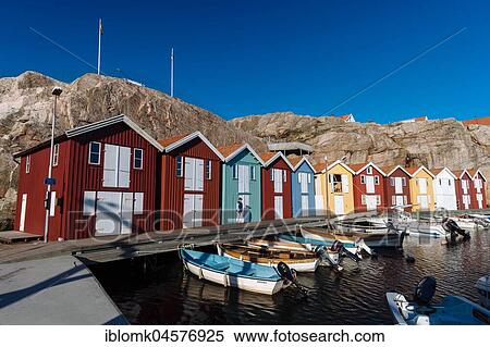 Stock Photography - Boats and colourful boathouses in the harbour of Smögen, Smögenbryggan, Västra Götalands Län, Bohuslän, Schwedena. Fotosearch