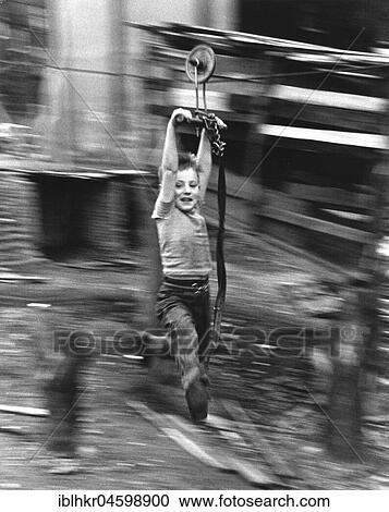 Boy hangs on wire rope, England, Great Britain View Large Photo Image Stock Image - Boy hangs on wire rope, England, Great Britain. Fotosearch