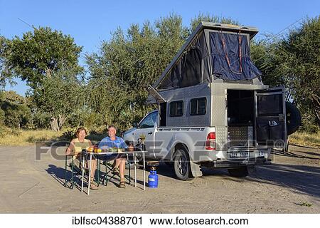 Stock Image - Breakfast at Dijara Campsite, Khwai River, Mababe Village, Botswana, Africa. Fotosearch