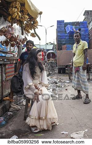 Bride sitting in front of a market stall, Dhaka, Bangladesh, Asia View Large Photo Image Stock Photograph - Bride sitting in front of a market stall, Dhaka, Bangladesh, Asia. Fotosearch