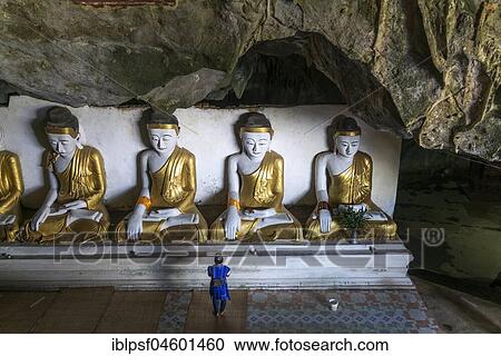 Stock Image - Buddha statues in the Kawgun Cave, Hpa-an, Myanmar, Asia. Fotosearch