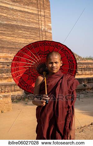 Buddhist monk stands with red umbrella in front of Mingun Pagoda, Mingun, Myanmar, Asia View Large Photo Image Stock Photo - Buddhist monk stands with red umbrella in front of Mingun Pagoda, Mingun, Myanmar, Asia. Fotosearch