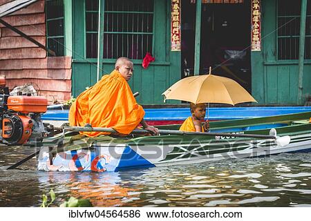 Buddhist monks in motorboat, floating village, boat trip, Tonle Sap Lake, Cambodia, Southeast Asia, Asia View Large Photo Image Stock Photograph - Buddhist monks in motorboat, floating village, boat trip, Tonle Sap Lake, Cambodia, Southeast Asia, Asia. Fotosearch