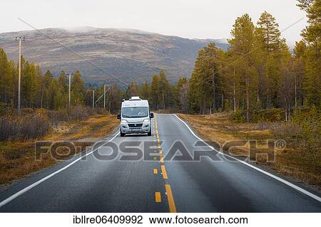 Stock Image - Campervan drives on the road to Kautokeino in autumn, Kautokeino, Finnmark, Norway, Europe. Fotosearch