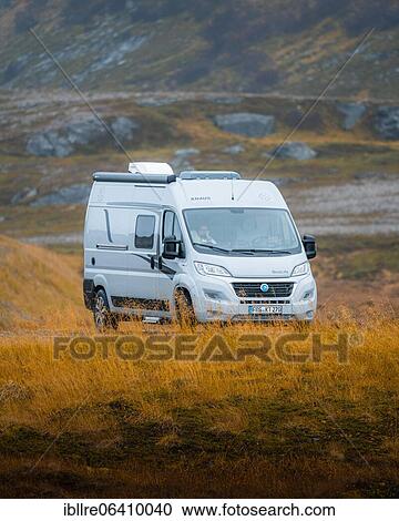 Stock Image - Campervan parked on grassed parking lot near Kåfjord, North Cape, Norway, Europe. Fotosearch