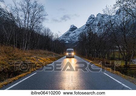 Campervan with bright lights on road near Trollstigen, Trollstigen, Norway, Europe View Large Photo Image Stock Image - Campervan with bright lights on road near Trollstigen, Trollstigen, Norway, Europe. Fotosearch
