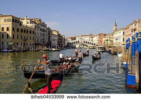 Stock Photo - Canal Grande, gondolas with tourists in front of Rialto Bridge, Venice, Veneto, Italy, Europe. Fotosearch