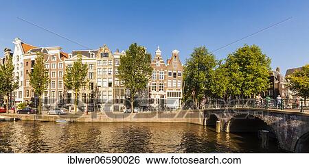 Stock Photograph - Canal houses in the Keizersgracht, bridge, canal, canal belt, old town, Amsterdam, Netherlands. Fotosearch
