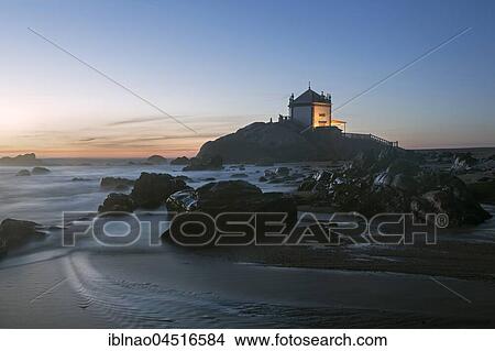 Capela do Senhor da Pedra, Chapel at dusk, rocky beach, Portugal, Europe View Large Photo Image Picture - Capela do Senhor da Pedra, Chapel at dusk, rocky beach, Portugal, Europe. Fotosearch