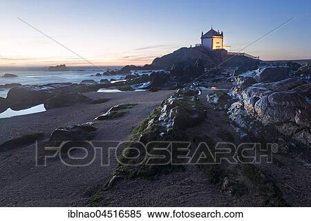 Capela do Senhor da Pedra, Chapel at dusk, rocky beach, Portugal, Europe View Large Photo Image Stock Photography - Capela do Senhor da Pedra, Chapel at dusk, rocky beach, Portugal, Europe. Fotosearch
