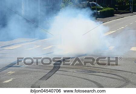 Car burning tire on a street, Rydsgård, Scania, Sweden, Europe View Large Photo Image Stock Photograph - Car burning tire on a street, Rydsgård, Scania, Sweden, Europe. Fotosearch