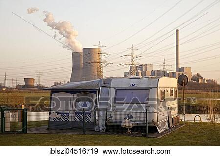 Stock Photo - Caravan at the campground Uentrop Helbach, power station Westfalen at back, Hamm, Ruhr district, North Rhine-Westphalia, Germany, Europe. Fotosearch