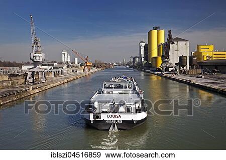 Cargo ship on the Datteln-Hamm Canal in city port, Hamm, Ruhr district, North Rhine-Westphalia, Germany, Europe View Large Photo Image Stock Photo - Cargo ship on the Datteln-Hamm Canal in city port, Hamm, Ruhr district, North Rhine-Westphalia, Germany, Europe. Fotosearch