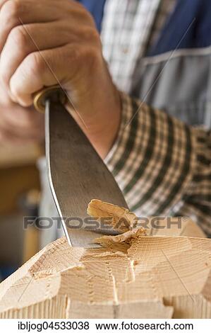 Carving a wooden block using wood carving tools, wooden mask carver, Bad Aussee, Styria, Austria, Europe View Large Photo Image Stock Photo - Carving a wooden block using wood carving tools, wooden mask carver, Bad Aussee, Styria, Austria, Europe. Fotosearch