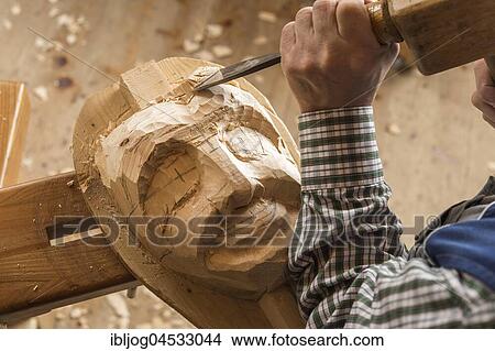Picture - Carving the face of a wooden mask into wooden block using wood carving tools, wooden mask carver, Bad Aussee, Styria, Austria, Europe. Fotosearch