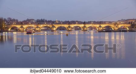 Charles Bridge over the River Vltava at dusk, seen from island Strelecky ostrov, Prague, Czech Republic, Europe View Large Photo Image Stock Image - Charles Bridge over the River Vltava at dusk, seen from island Strelecky ostrov, Prague, Czech Republic, Europe. Fotosearch