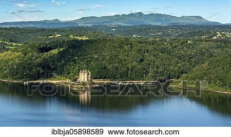 Chateau de Val at Lac de Bort-les-Orgues, Massif du Sancy behind, Lanobre, Cantal department, Auvergne Rhone Alpes, France, Europe View Large Photo Image Stock Photo - Chateau de Val at Lac de Bort-les-Orgues, Massif du Sancy behind, Lanobre, Cantal department, Auvergne Rhone Alpes, France, Europe. Fotosearch