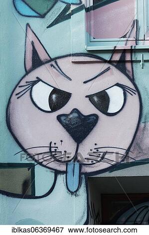 Stock Photo - Cheeky cat shows tongue, graffito in comic style, Düsseldorf, North Rhine-Westphalia, Germany, Europe. Fotosearch