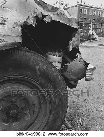 Stock Image - Child in old car, England, Great Britain. Fotosearch