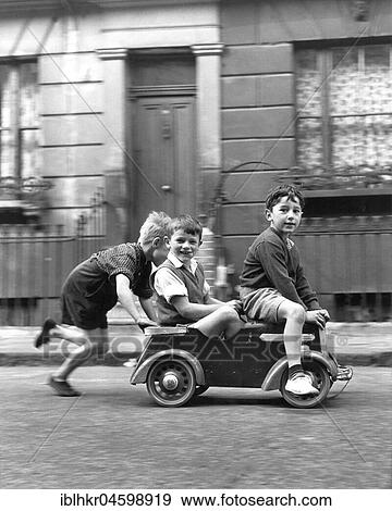 Stock Photo - Children drive soapboxes, England, Great Britain. Fotosearch