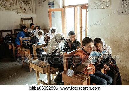 Children in a classroom, a girl and a boy reading together from an exercise book, Potokh Primary School, Potokh, Wakhan Corridor, Afghanistan, Asia View Large Photo Image Stock Photography - Children in a classroom, a girl and a boy reading together from an exercise book, Potokh Primary School, Potokh, Wakhan Corridor, Afghanistan, Asia. Fotosearch
