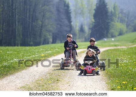Stock Image - Children in Franconian countryside, Lochau, Eggersdorf, Bavaria, Germany, Europe. Fotosearch