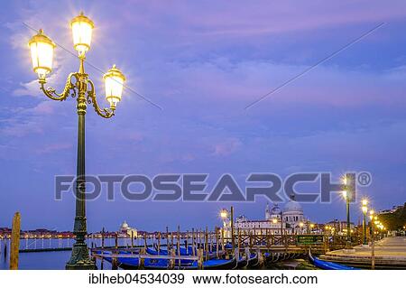 Church Santa Maria della Salute with gondolas at dusk, Venice, Veneto, Italy, Europe View Large Photo Image Stock Photo - Church Santa Maria della Salute with gondolas at dusk, Venice, Veneto, Italy, Europe. Fotosearch