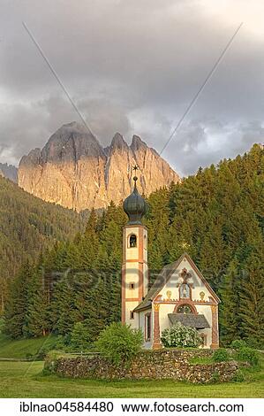 Stock Image - Church St. Johann in Ranui with Odle Group mountain range, Villnöß valley, Alto Adige, Italy, Europe. Fotosearch