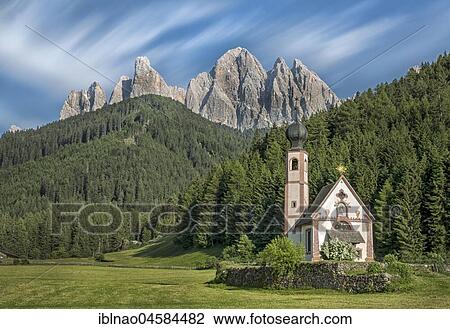 Stock Image - Church St. Johann in Ranui with Odle Group mountain range, Villnöß valley, Alto Adige, Italy, Europe. Fotosearch