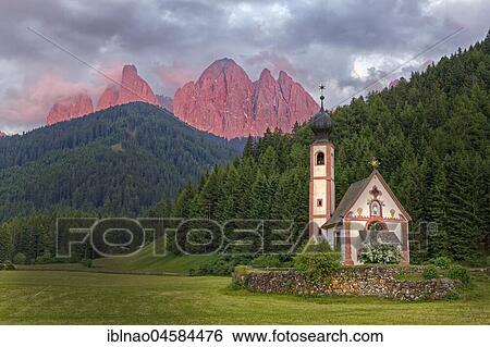 Stock Photograph - Church St. Johann in Ranui with Odle Group mountain range, Villnöß valley, Alto Adige, Italy, Europe. Fotosearch