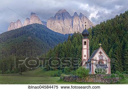 Stock Photography - Church St. Johann in Ranui with Odle Group mountain range, Villnöß valley, Alto Adige, Italy, Europe. Fotosearch