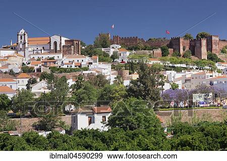 Stock Photo - City view, old town with cathedral and castle, Silves, Algarve, Portugal, Europe. Fotosearch