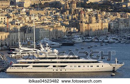 Stock Image - Cityscape with Marina at Dockyard Creek, luxury yacht, Indian Empress, Vittoriosa, Birgu, The Three Cities, Malta, Europe. Fotosearch